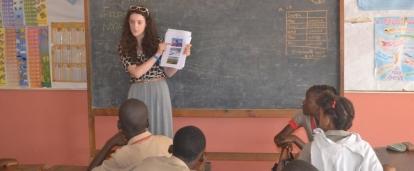 A Human Rights intern in Jamaica talks to students at a primary school during an outreach activity. A Human Rights intern in Jamaica gains work experience during an outreach.
